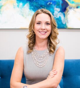 A photo of Dr. Kate Campbell is captured. She is featured on The Grow A Group Practice, a podcast for group private practice owners with Alison Pidgeon. They speak about how to take maternity leave as a business owner.