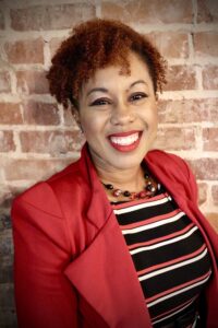 A photo of Nakita Scott is captured. Nakita W. Scott is a Licensed Clinical Social Worker living and practicing in Central Florida. She is featured on Grow a Group Practice, a therapist podcast.