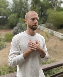 A photo of Harry Sherwood is captured. He is a trainer and mindful and wellness coach. Harry is featured on the Practice of the Practice, a therapist podcast.