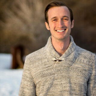 A photo of Alex Theobald is captured. He is a family therapist and clinical data scientist. Alex is featured on the Practice  of the Practice, a therapist podcast.