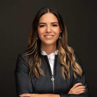 A photo of Claudia Gonzalez, PsyD. is captured. She is a bilingual clinical psychologist and the owner and founder of Goal Mentality Psychotherapy & Medication services. Dr. Claudia is featured on Grow a Group Practice, a therapist podcast.