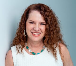 A photo of Mary Beth Simon is captured. She  guides business owners to create contingency plans
that prepare them and their teams for extended vacations or
the unexpected. Mary Beth is featured on the Practice of the Practice, a therapist podcast.