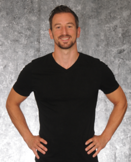 A photo of Adam Lewis Walker is captured. He is a former Olympic hopeful Pole vaulter, a 2-time best-selling author, and was named “Top 10 Dads in Podcasting” by Podcast Magazine. Adam is featured on the Practice of the Practice, a therapist podcast.