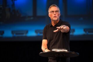 A photo of Marty Collier is captured. He is a pastor at Rush Creek. Marty is featured on Grow a Group, a therapist podcast.