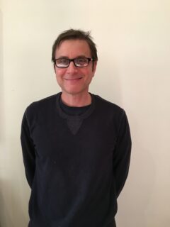 A photo of David Sternberg is captured. He owns a psychotherapy group practice in Washington, D.C., called DC Talk Therapy. David is featured on the Practice of the Practice, a therapy podcast.
