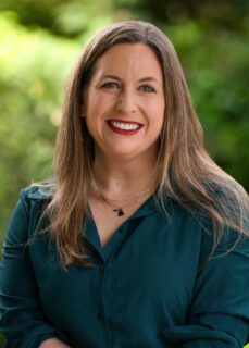 A photo of Lindsay Oberleitner, Ph.D., LP, is captured. She is a licensed clinical psychologist and Head of Clinical Strategy at SimplePractice, where she applies evidence-based practices to drive strategic clinical decision-making and advocate for mental health providers. Dr Oberleitner is featured on the Practice of the Practice, a therapist podcast.